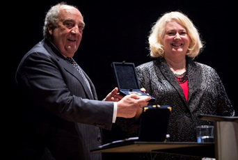 Attorney Barbara J Gislason being presented with the UIA Monique Raynaud-Contamine Award
